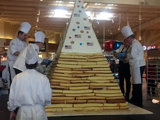 The World's tallest pyramid cake stood at 9 feet and 2 inches, breaking the previous Guinness World Record for tallest pyramid cake.